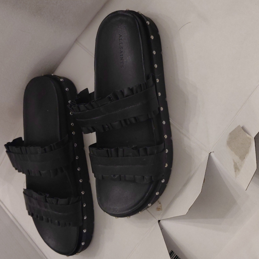 All Saints Slides in black , studded and frills